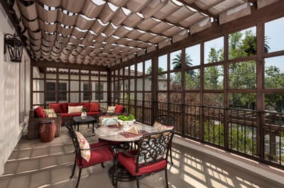 Covered outdoor seating area with plants