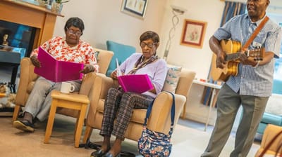 Residents enjoying music and activities in a common area