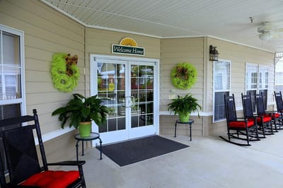 Welcoming entrance with rocking chairs and decorations