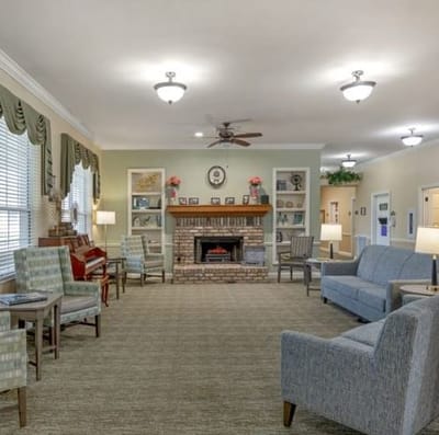 Interior common area with seating and a fireplace