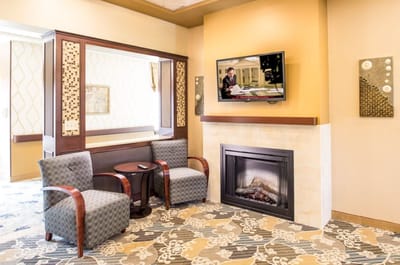 Cozy common area with seating and a fireplace