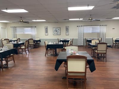 Dining area with tables and chairs set for meals