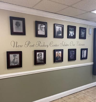 Wall honoring veterans with framed portraits