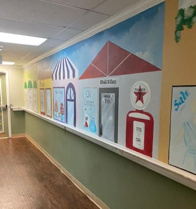 Colorful mural in a hallway of a senior living facility