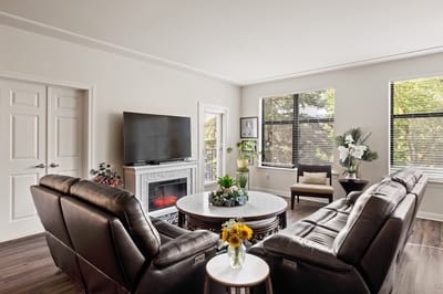 Inside view of a cozy common area with seating and decor