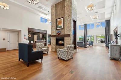 Bright common area with seating and fireplace