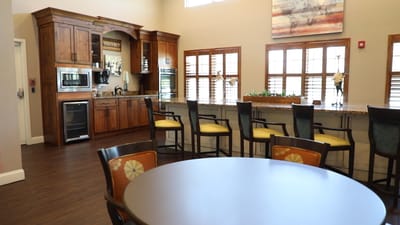 Interior view of a common area with seating and kitchenette