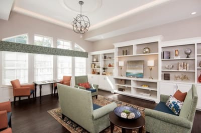 A bright interior lounge with seating and decor