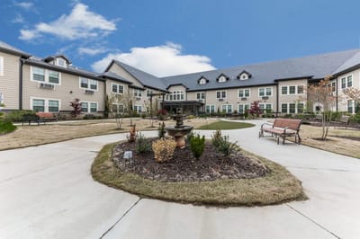 Outdoor view of the landscaped courtyard at a senior living facility