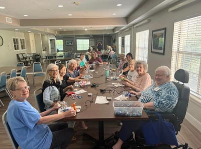 Residents participating in a craft activity in a common area