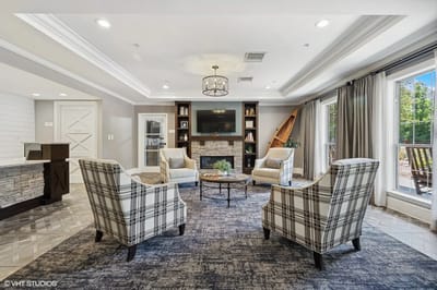 Cozy common area with comfortable seating and bookshelves