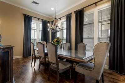 Elegant dining room with a long table and chairs