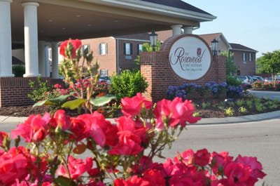 Exterior view of The Rosewood at Fort Oglethorpe with flowers