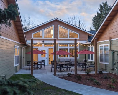 Outdoor patio area with seating and umbrellas