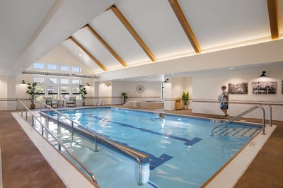Indoor swimming pool area with natural light