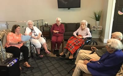 Residents participating in a group activity in a common area