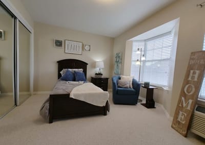 Cozy private room with bed and seating area