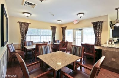 Dining area with multiple tables and chairs