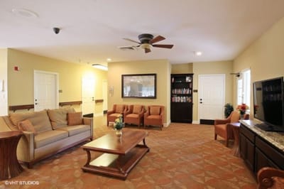 Bright common area with seating and bookshelves