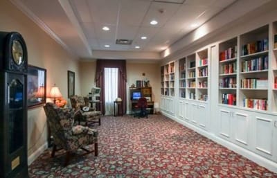 Cozy reading space with bookshelves and seating