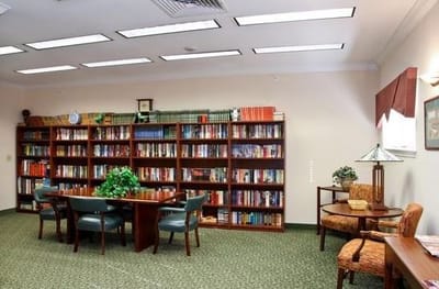 Interior view of a library with bookshelves and seating