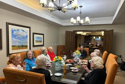 Residents enjoying tea and conversation in the dining room