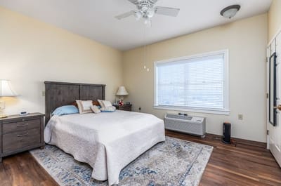 A private resident room with a bed and furniture