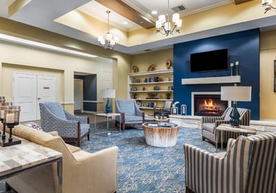 Lounge area with comfortable seating and a fireplace