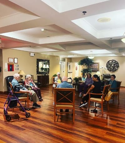 Residents participating in a group activity in a common area