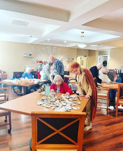 Residents engaged in a group activity at a table