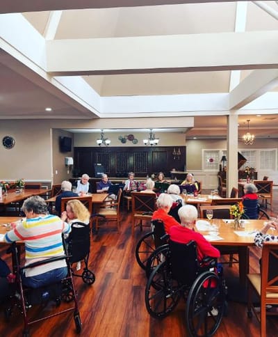 Residents enjoying a meal in the dining room
