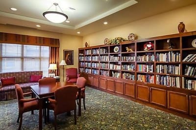 Cozy common area with bookshelves and seating