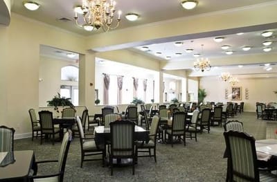 Dining area with tables and chairs in a bright room
