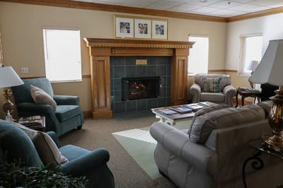 Cozy common area with comfortable seating and fireplace