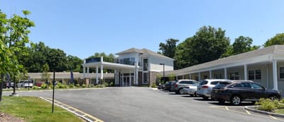 Exterior view of The Willows at Ramapo with parking area