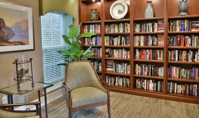 Cozy indoor library area with bookshelves and seating
