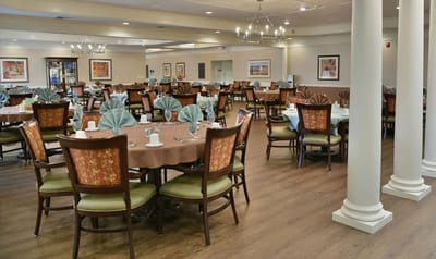 Dining room setup with tables and chairs