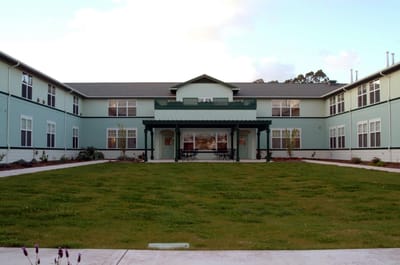 Exterior view of the Timber Ridge building with lawn