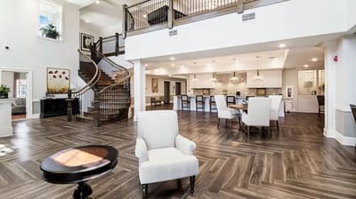 Spacious interior common area with seating and kitchen