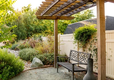 A serene outdoor garden area with seating
