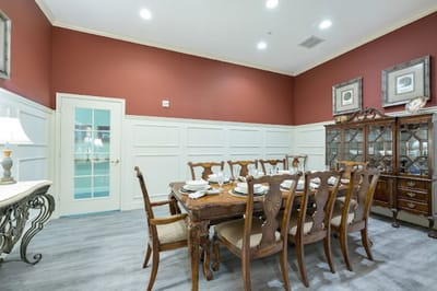Dining area with a large wooden table and dining ware