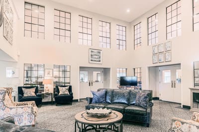 Cozy lounge area with comfortable seating and large windows