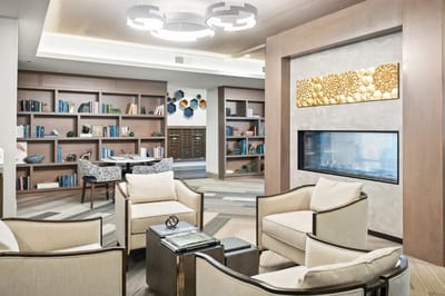 Common area with seating and bookshelves
