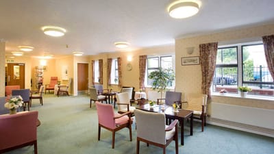 Bright common area with chairs and tables