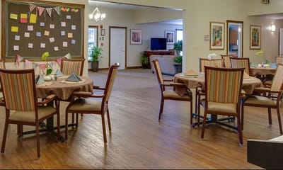 Dining area with tables set for residents