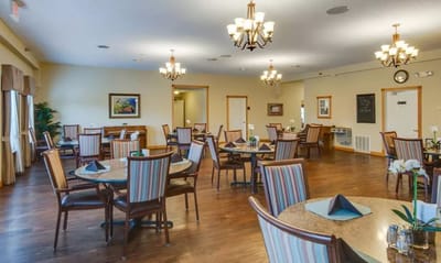 Bright dining room with tables set for meals