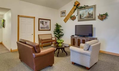 Common area with seating and TV
