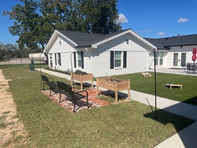Outdoor garden area with benches and planters