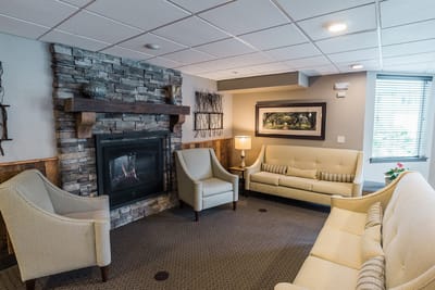 Cozy common area with seating and a fireplace