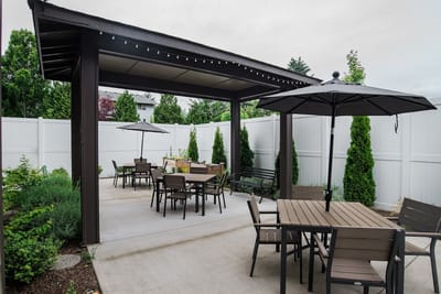 Outdoor patio area with tables and umbrellas